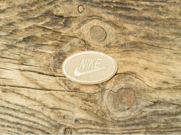 Термоаплікація Nike бежева 5х3 см арт. 15960