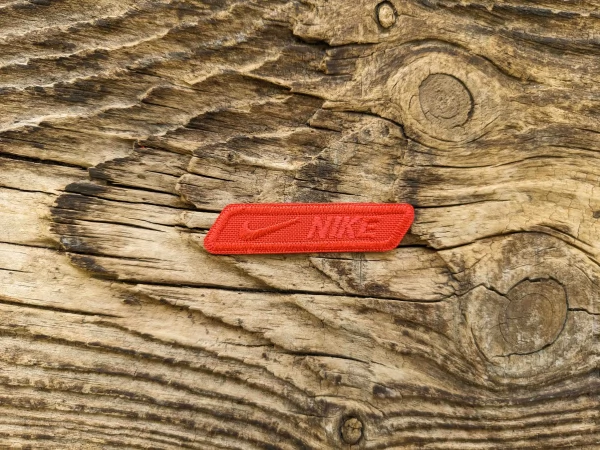 Термоаплікація Nike червона 6х1,5 см арт. 15735