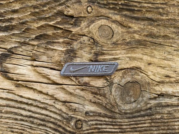 Термоаплікація Nike сірий 6х1,5 см арт. 15738